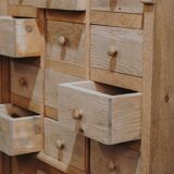 Solid oak dressmaker's cabinet with 13 drawers and 1 door