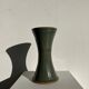 Dark green handcrafted vase with glazed ceramic grass blades