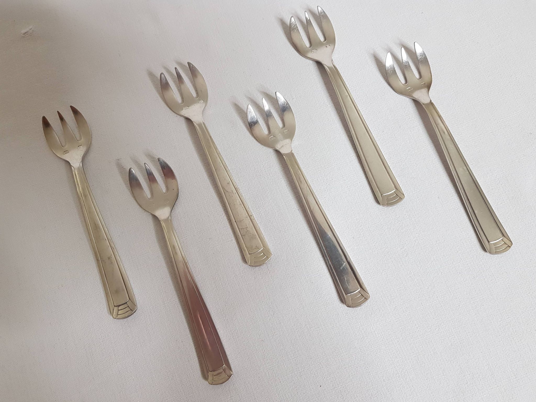 Six art deco silver metal oyster forks