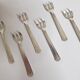 Six art deco silver metal oyster forks