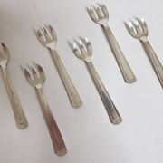 Six art deco silver metal oyster forks