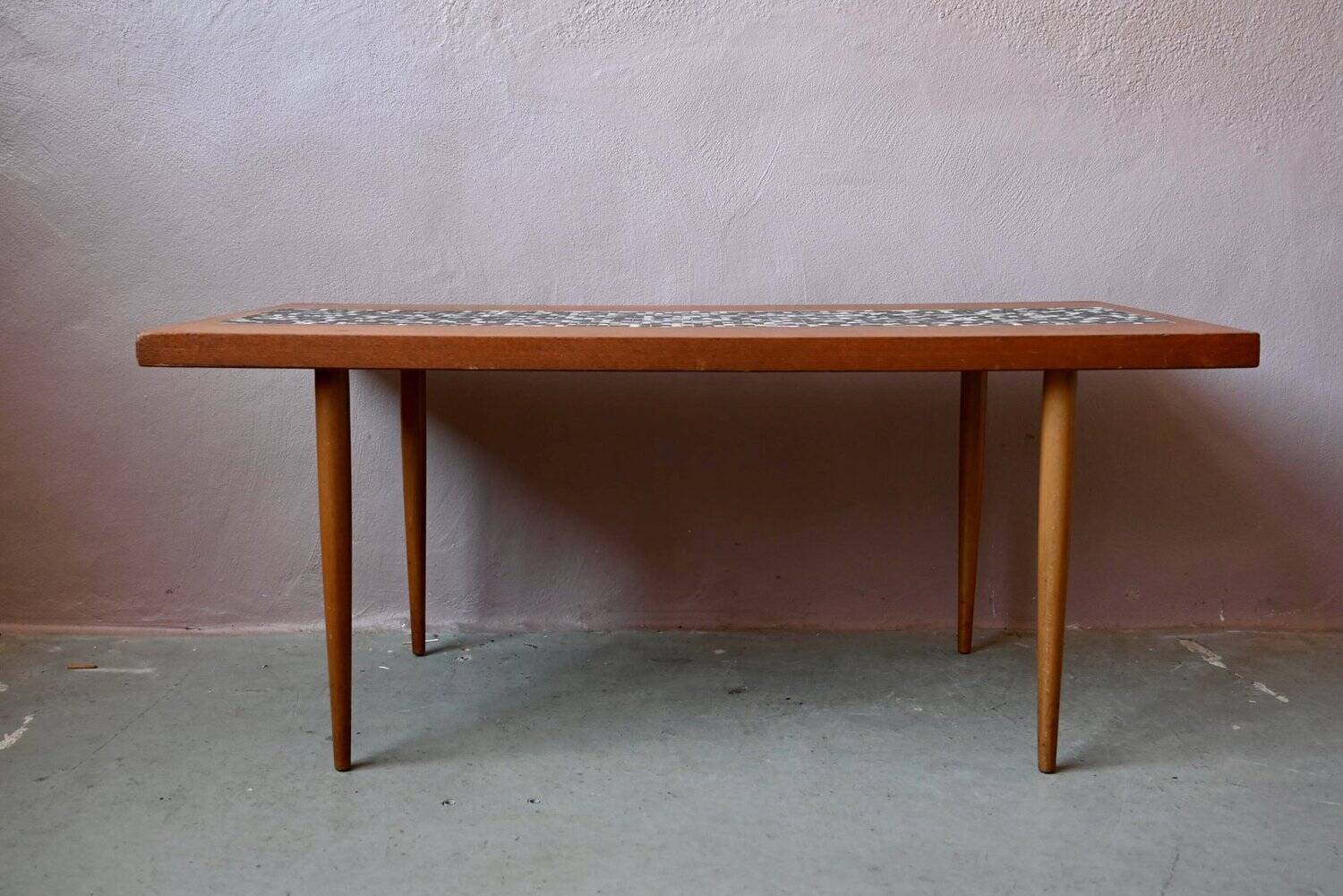 1970s coffee table with a tapered teak base and ceramic mosaic.
