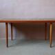 1970s coffee table with a tapered teak base and ceramic mosaic.
