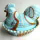 Sweet sugar candy Vallérysthal, blue opaline marbled with brown: Hen on nest