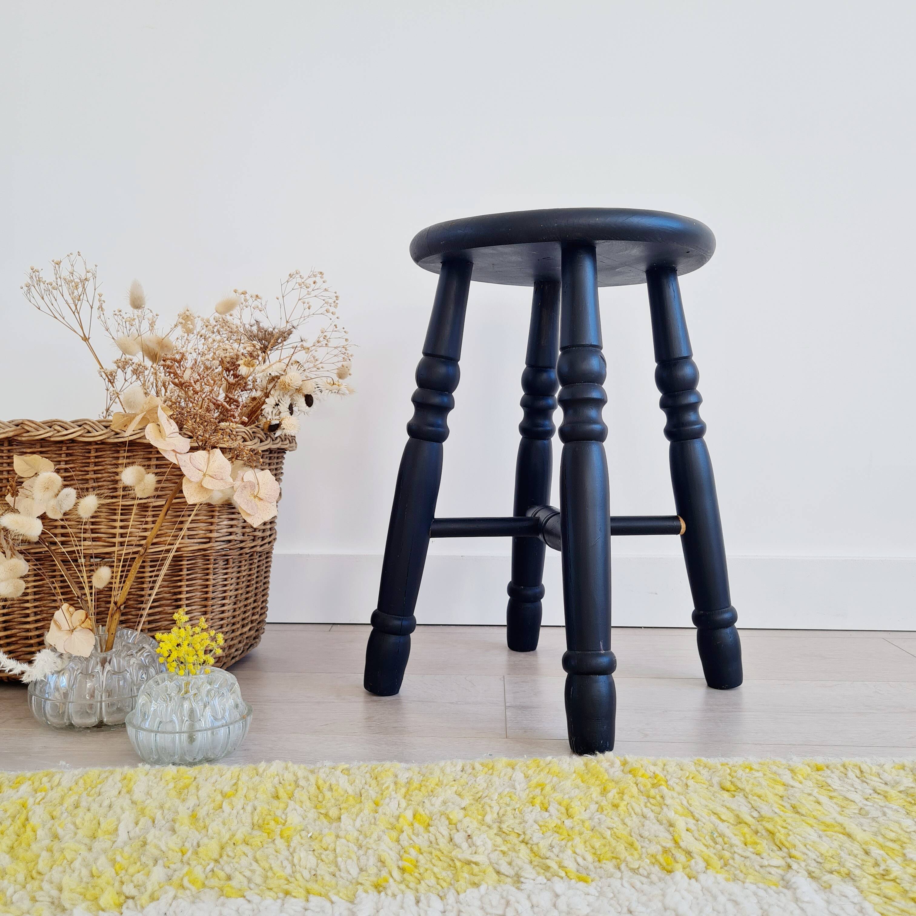 Antique black wooden stool, renovated