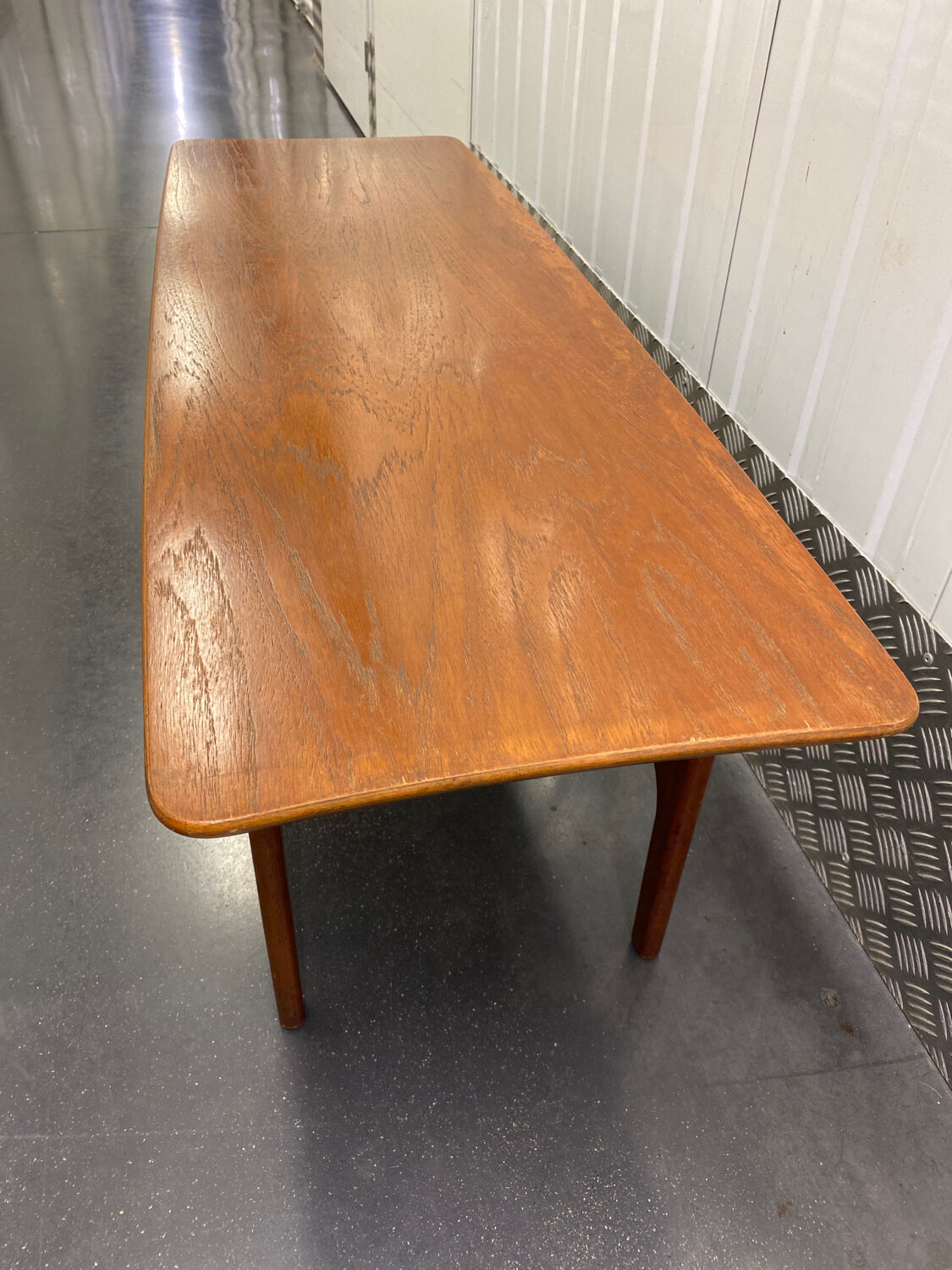 Teak coffee table with under top circa 1960