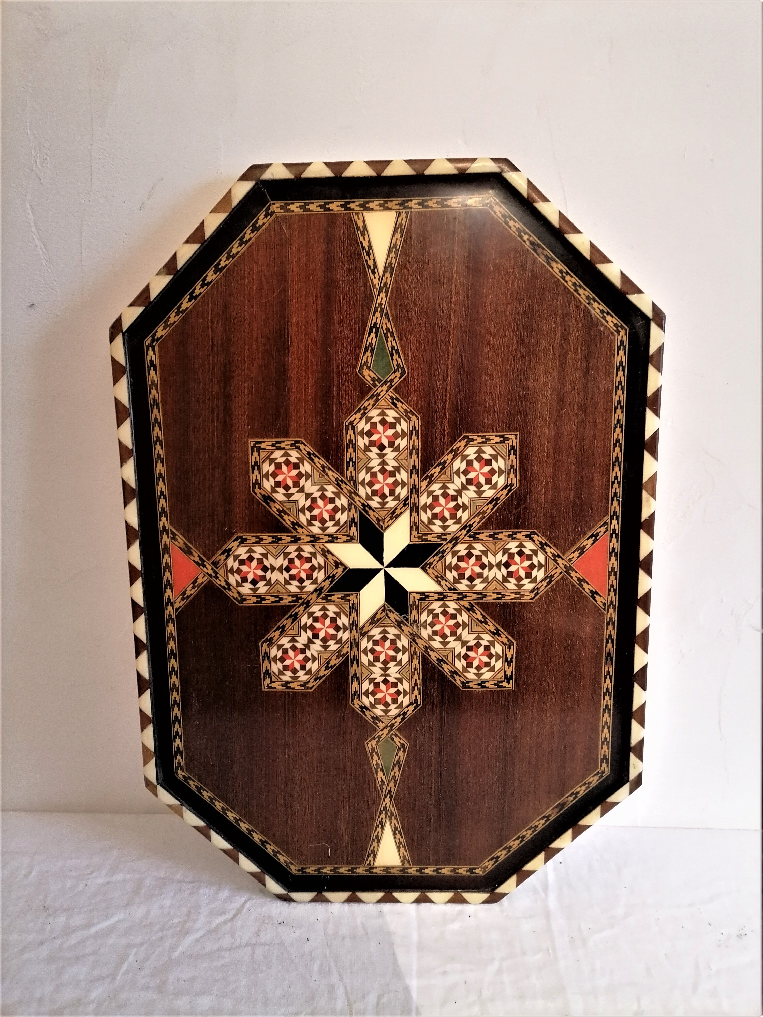 Old oriental plateau in marquetry.