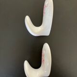 Antique porcelain hooks, the pair