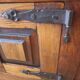 Old solid wood dough mixer carefully transformed into a bar cabinet.