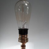 Golden and black tripod floor lamp