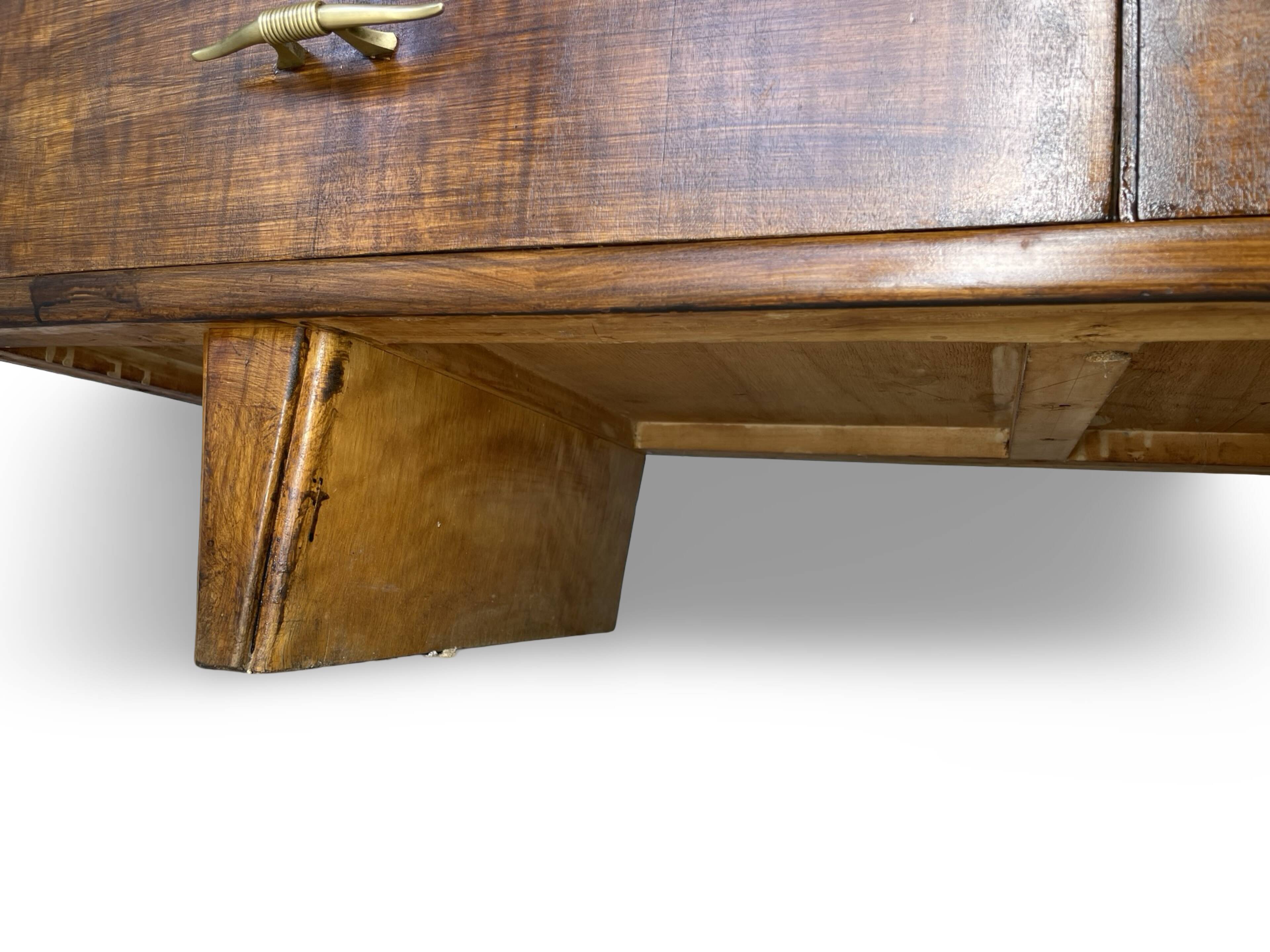 A vintage Italian chest of drawers, made of veneered walnut and solid wood,