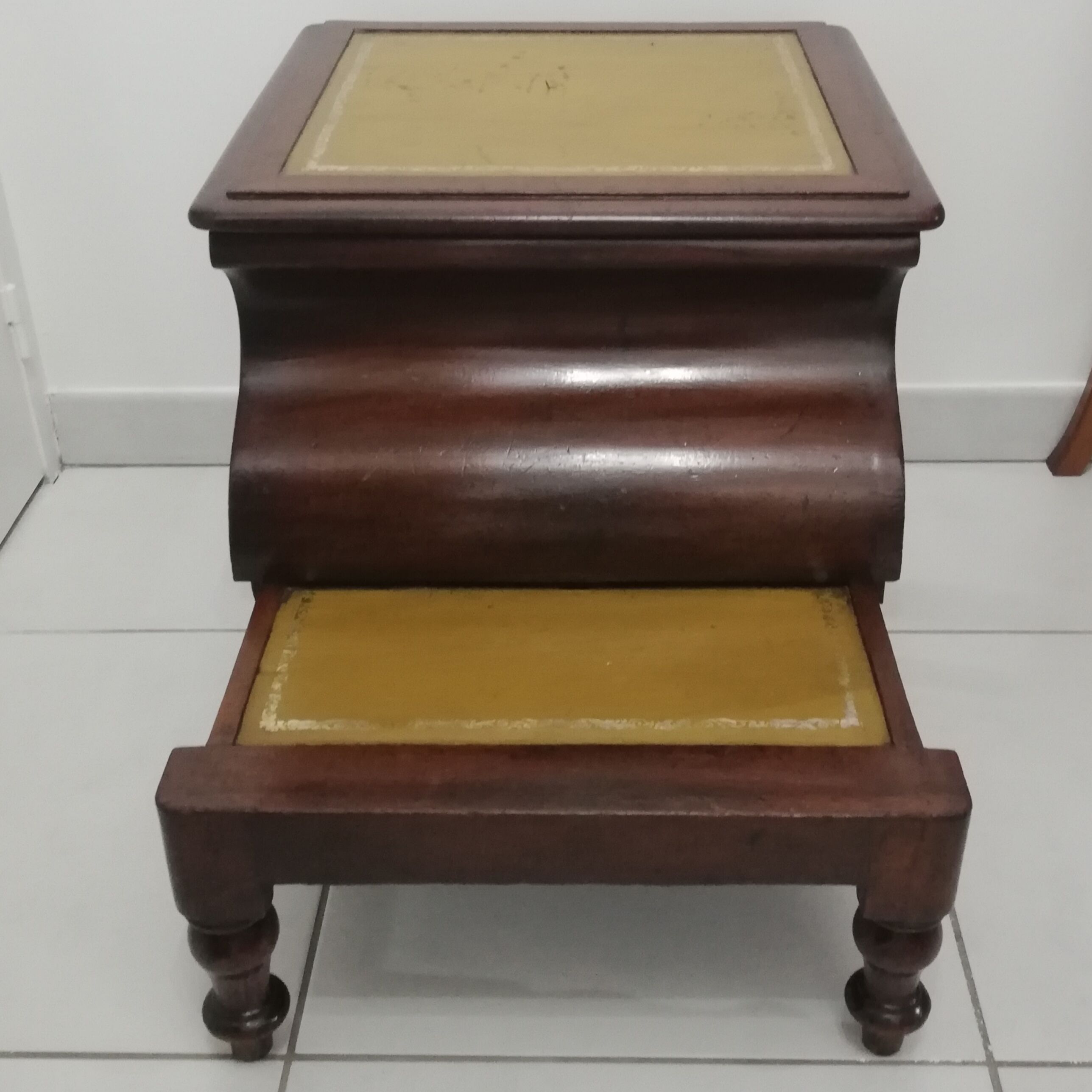 Old stepladder or English mahogany library foot walk