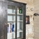 Display cabinet in patinated wood