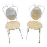 Pair of wrought iron garden chairs