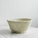 Bread basket - openwork white ceramic bowl.