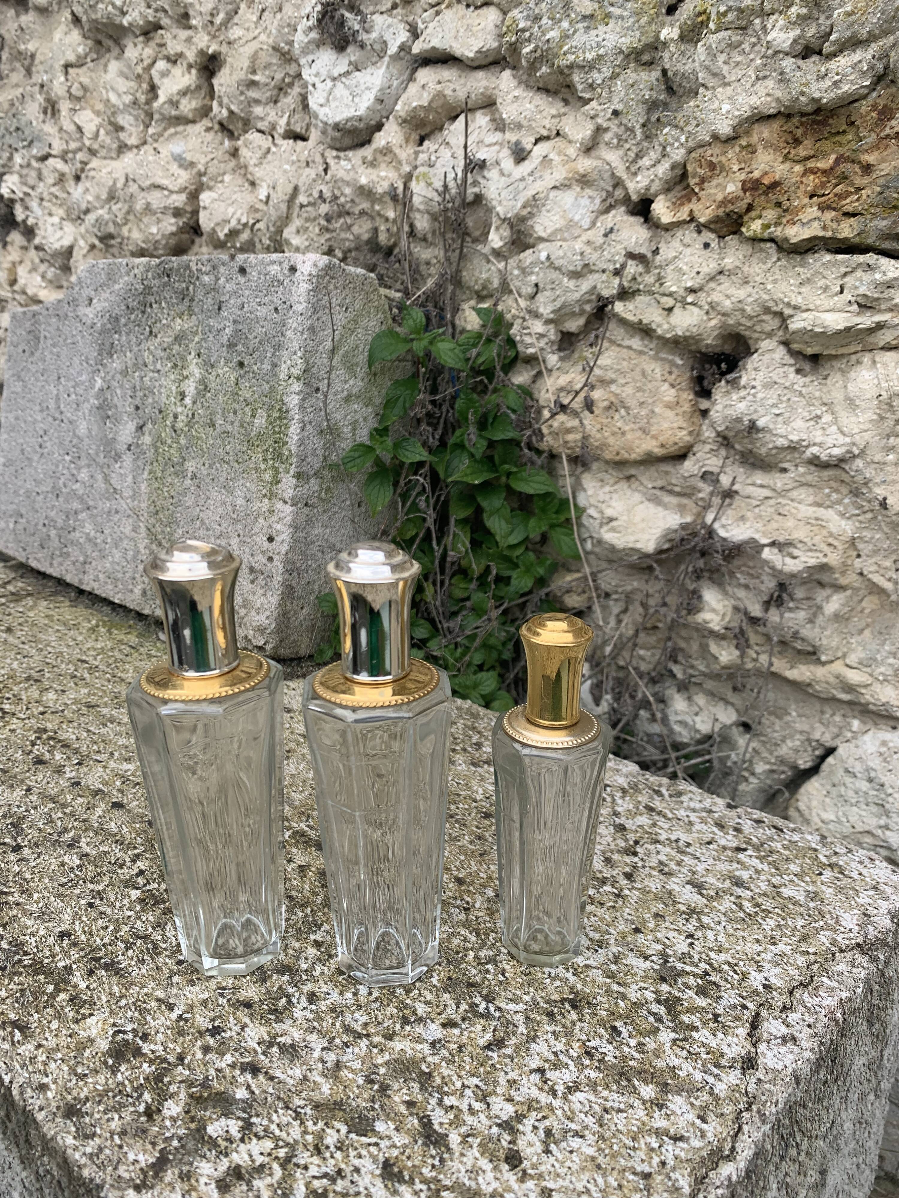 Three bottles of crystal perfume signed Marcel Rochas old france