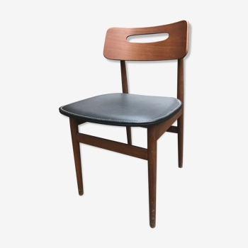 Scandinavian chair sitting in leatherette