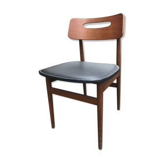 Scandinavian chair sitting in leatherette