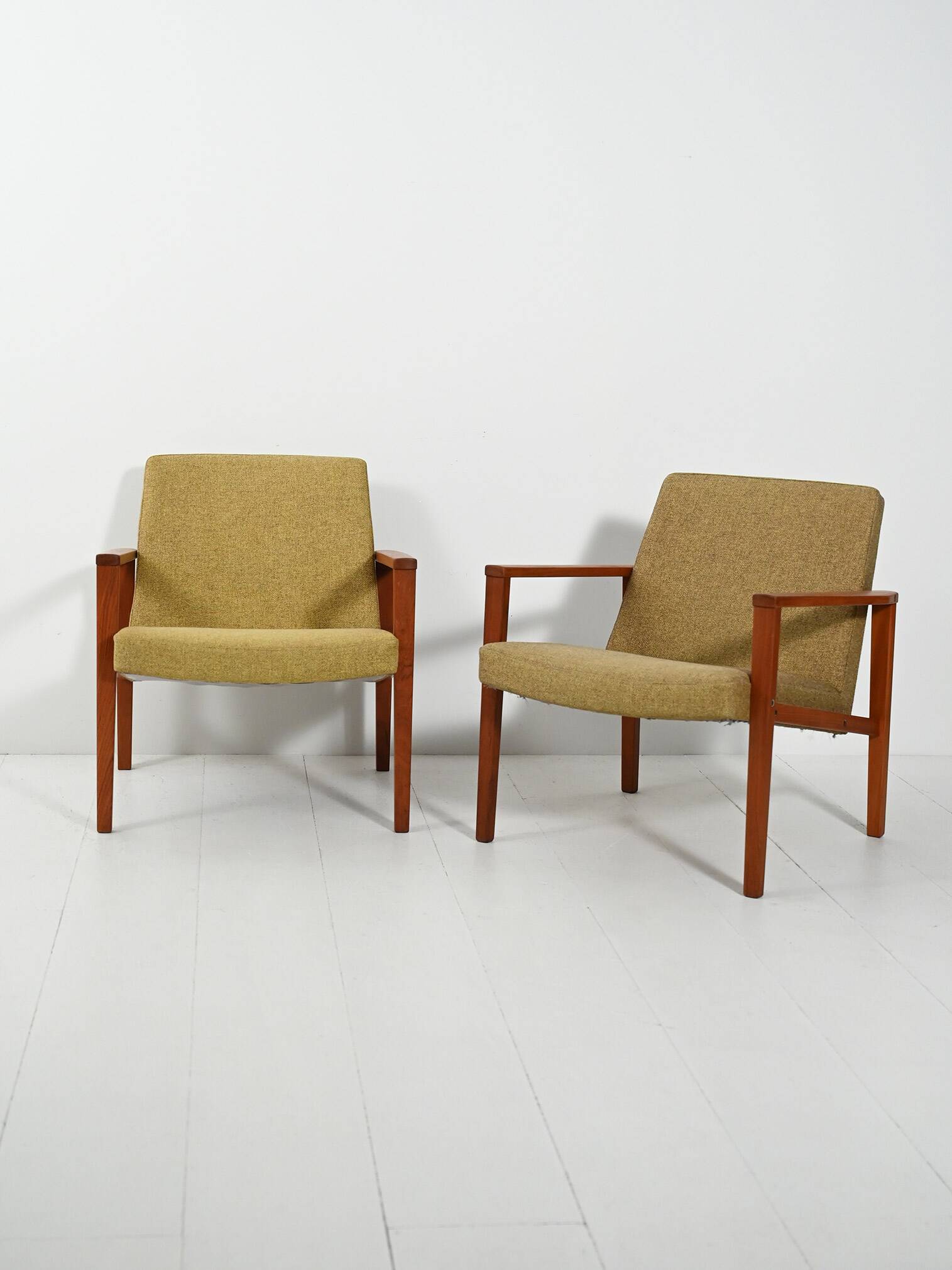Pair of Danish teak armchairs with green upholstery