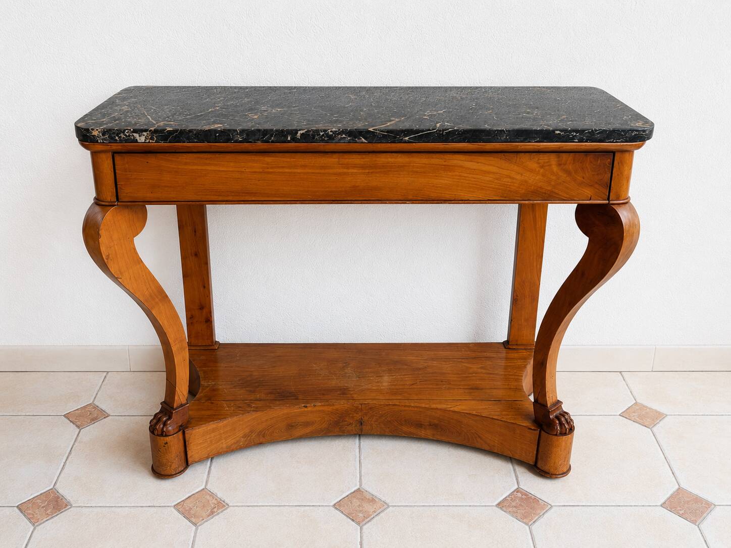 French console from the 19th century in cherry wood and black marble, with claw feet.