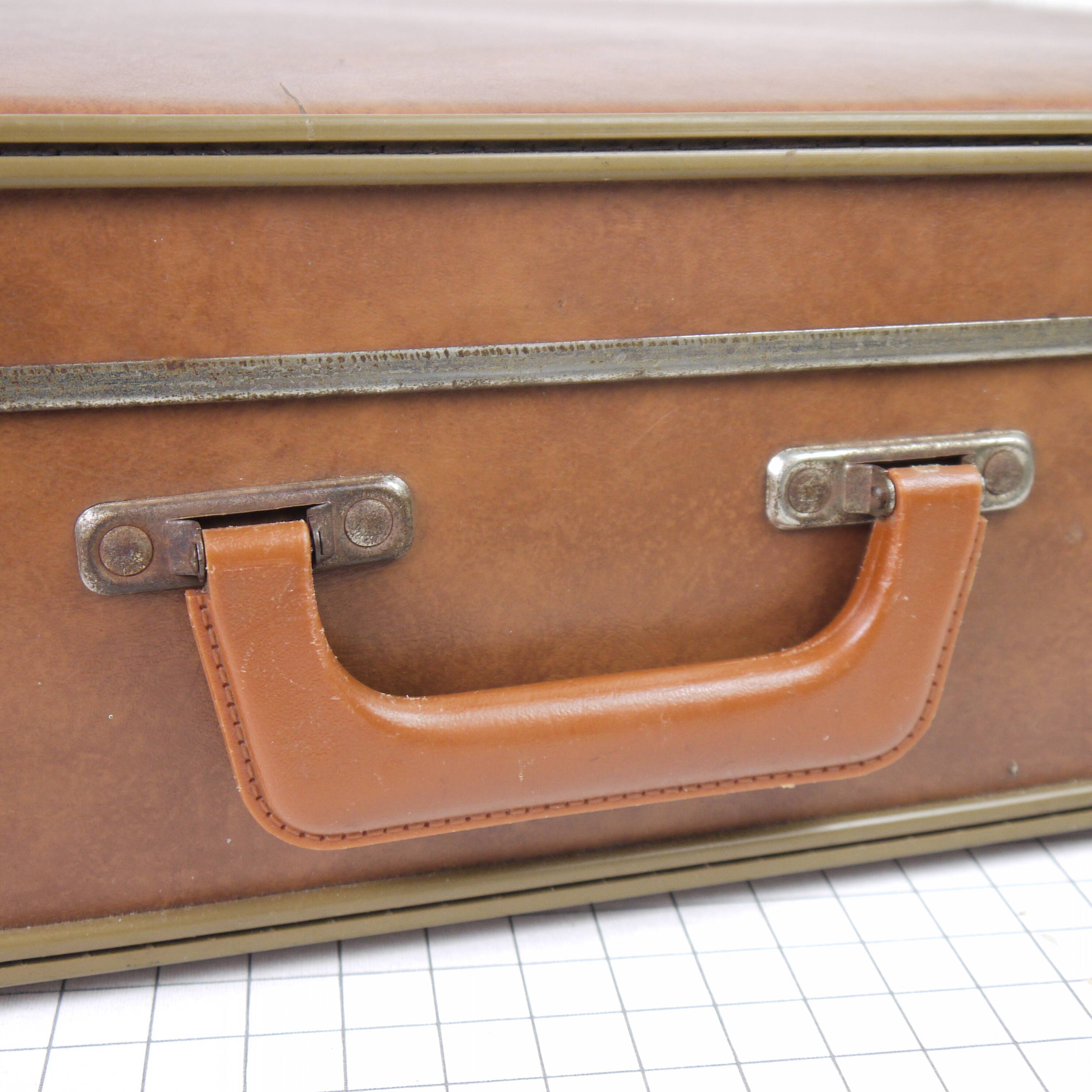 Cardboard and brown leather case