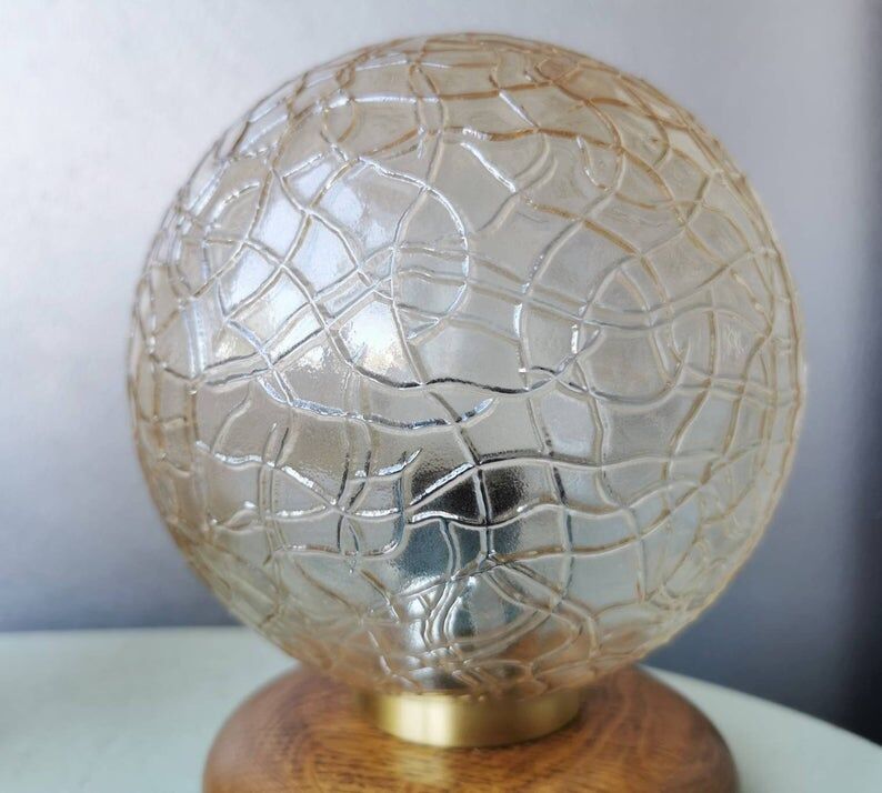 Wooden table lights with 70s gold glass hood