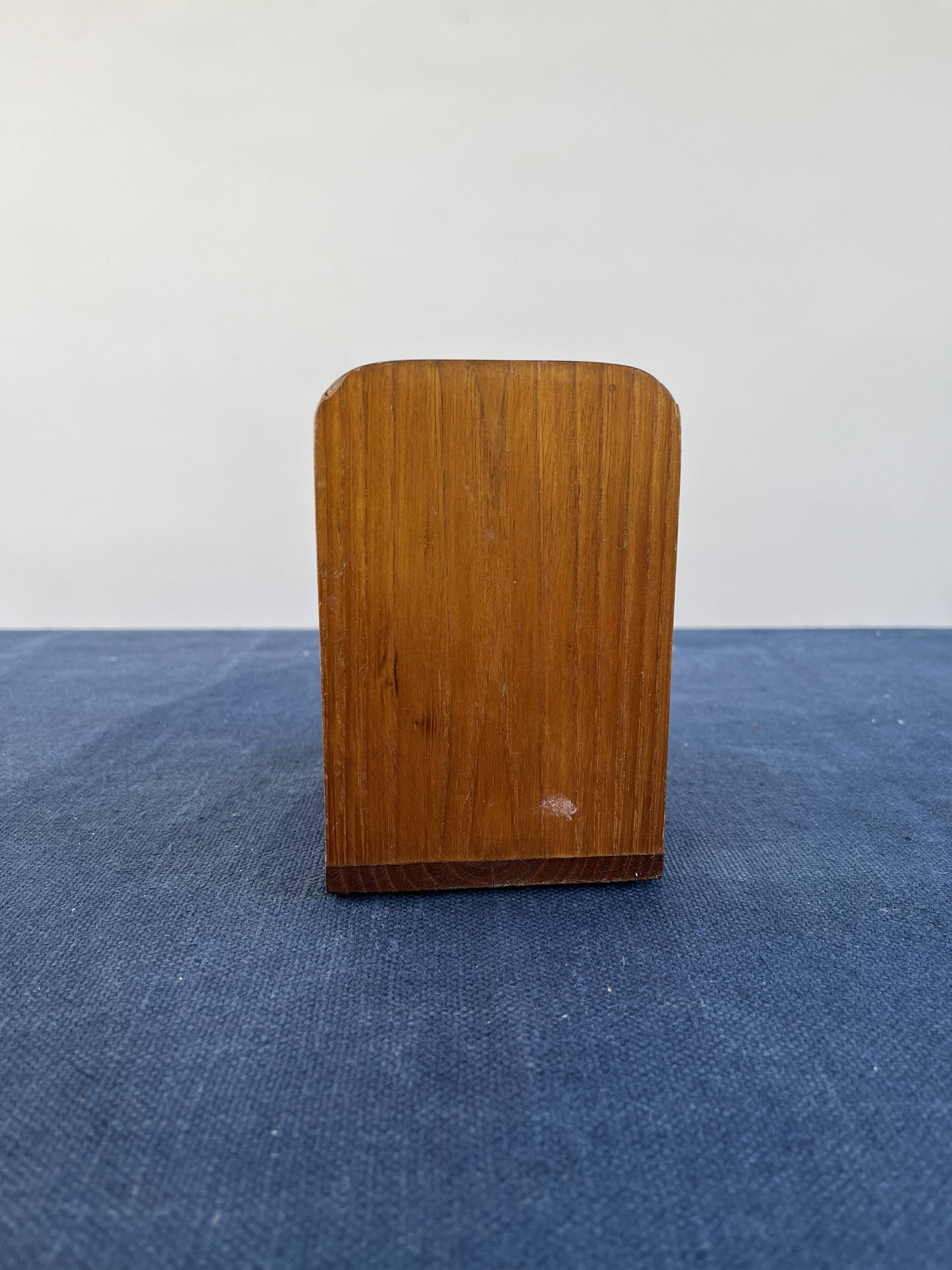 Rotating globe bookends on wooden base