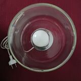 Table lamp, chrome glass stand and transparent glass globe.