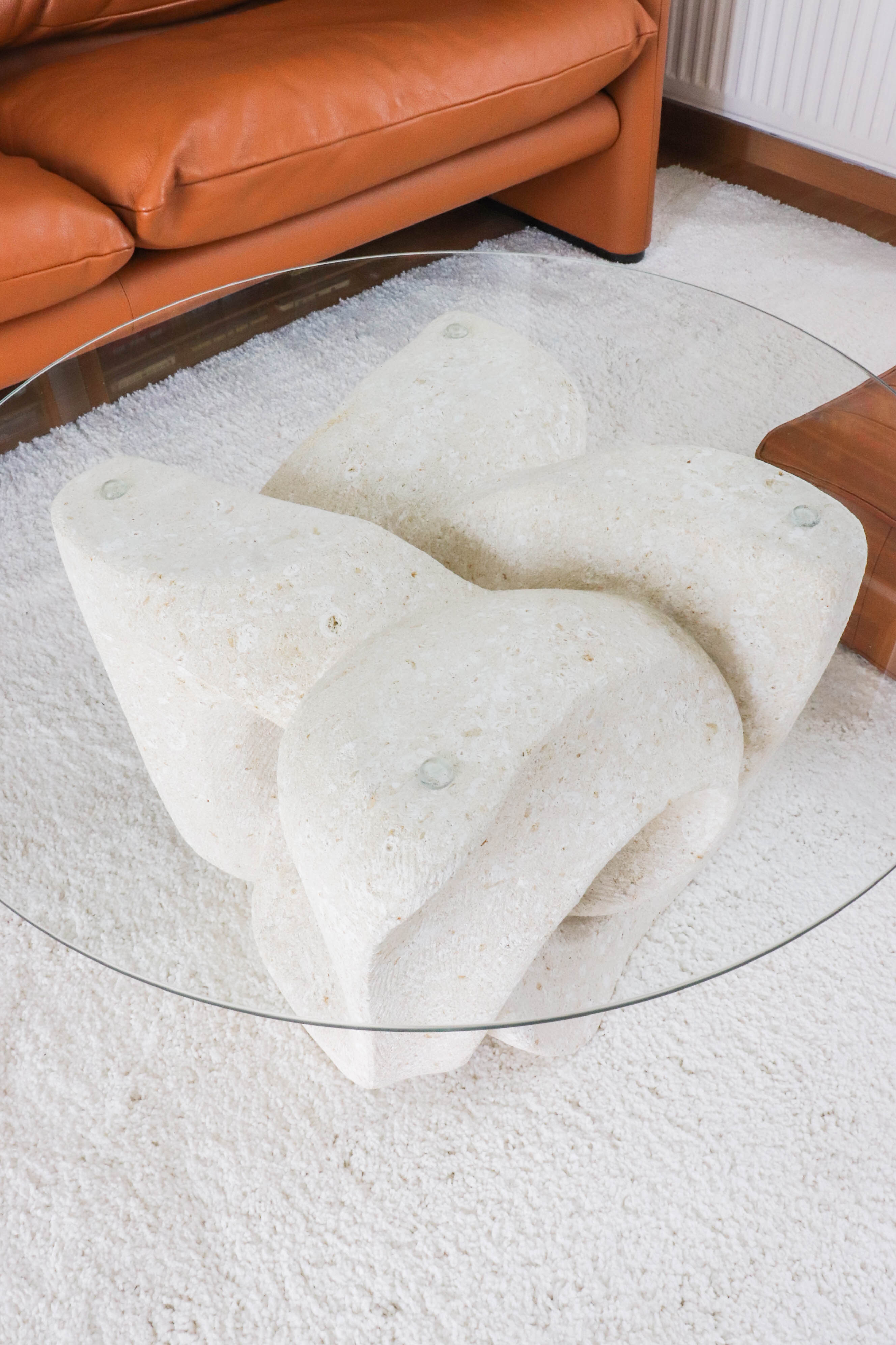A Vintage White Stone Coffee Table with Glass Table Top