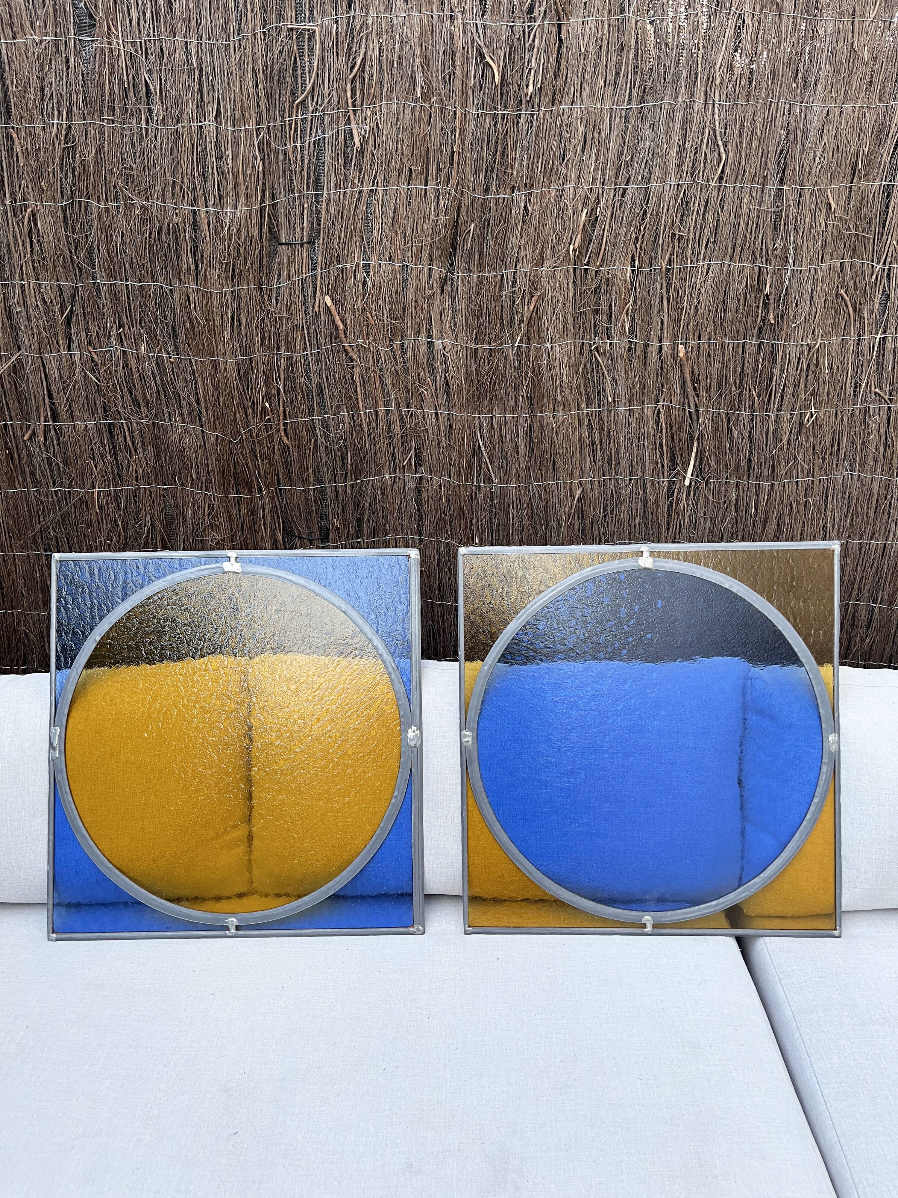 Pair of antique blue and yellow stained glass windows