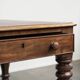 Antique English writing desk from the 19th century with a red leather top