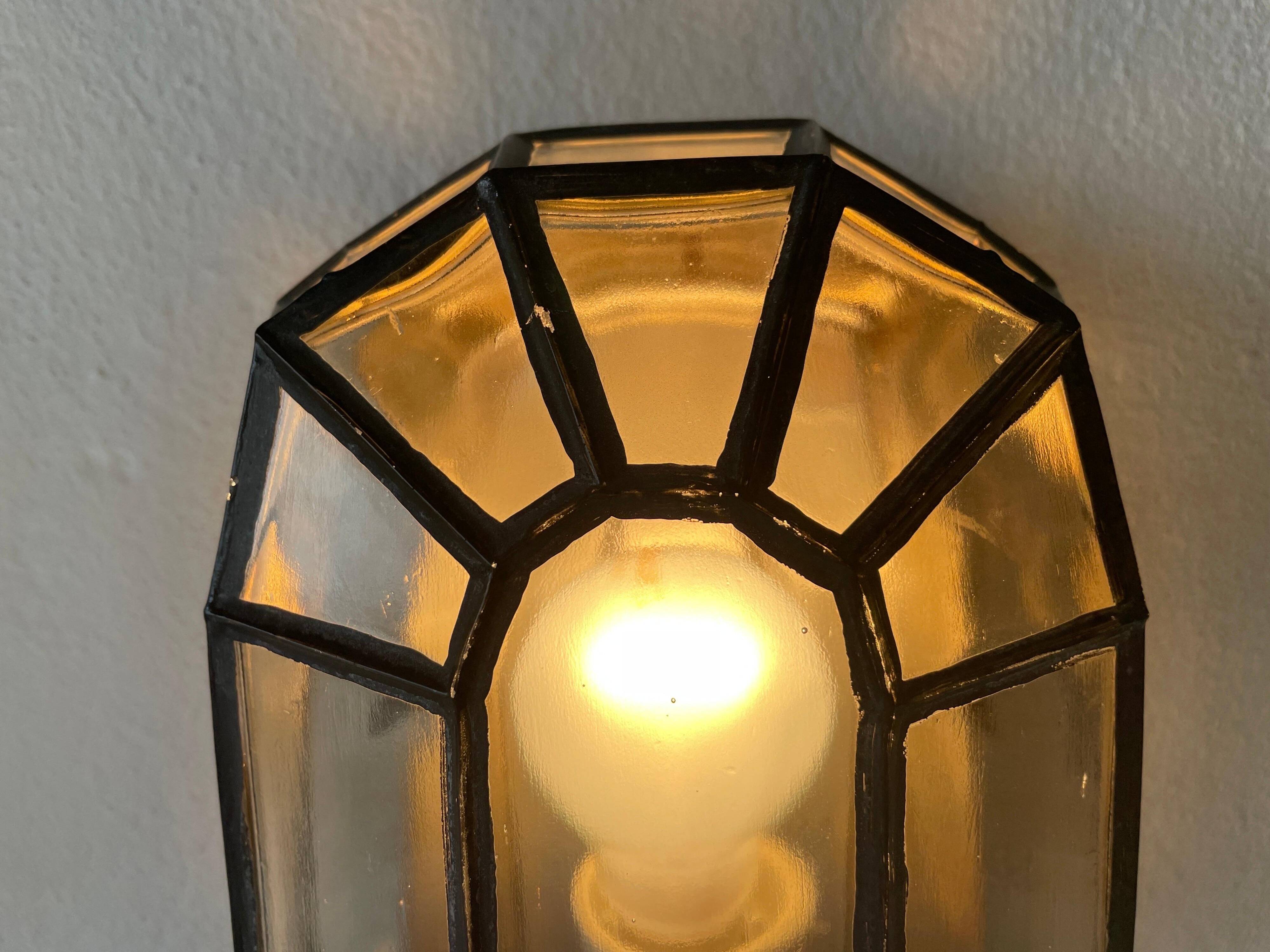 Pair of black iron wall sconces with structured glass by Limburg, 1960s, Germany.