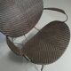 Fauteuil conçu par Yuzuru Yamakawa Structure en métal. Assise et dossier en rotin tressé.