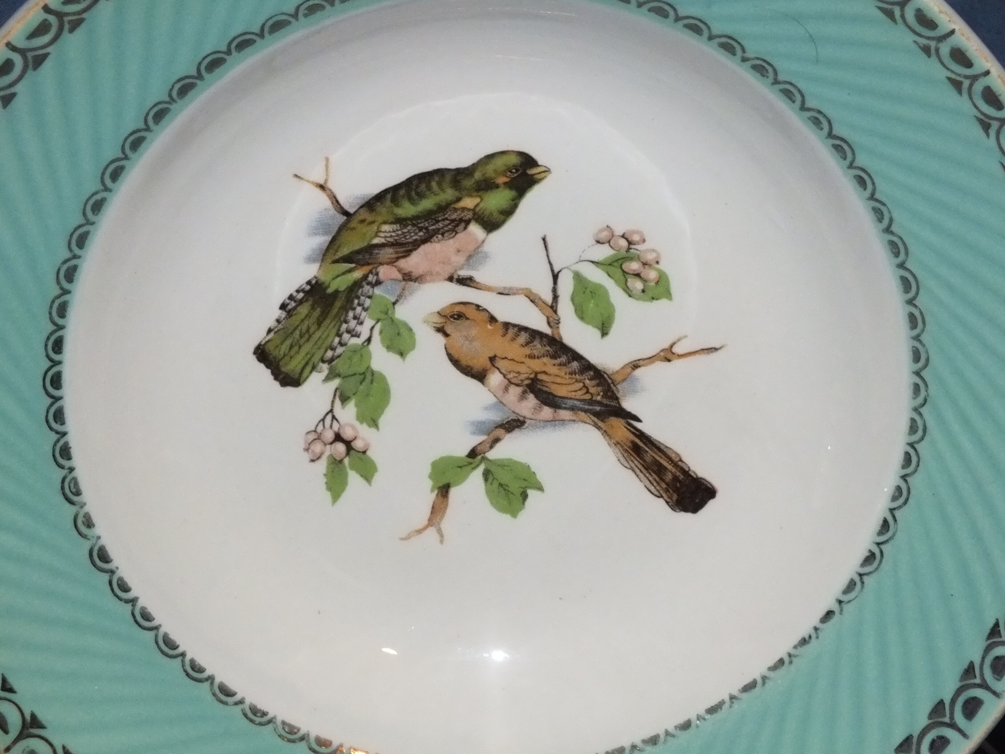 4 vintage hollow plates decorated with birds