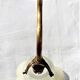 Brass gooseneck wall lamp, with brass socket and porcelain base.