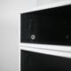 Storage cabinet wood compressed lacquered black lining margins aluminum. France, circa 1975.