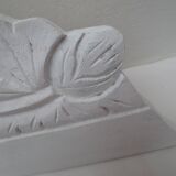 Decorative pediment in white carved wood