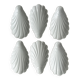 Set of white porcelain ramekins, ribbed shell shape.