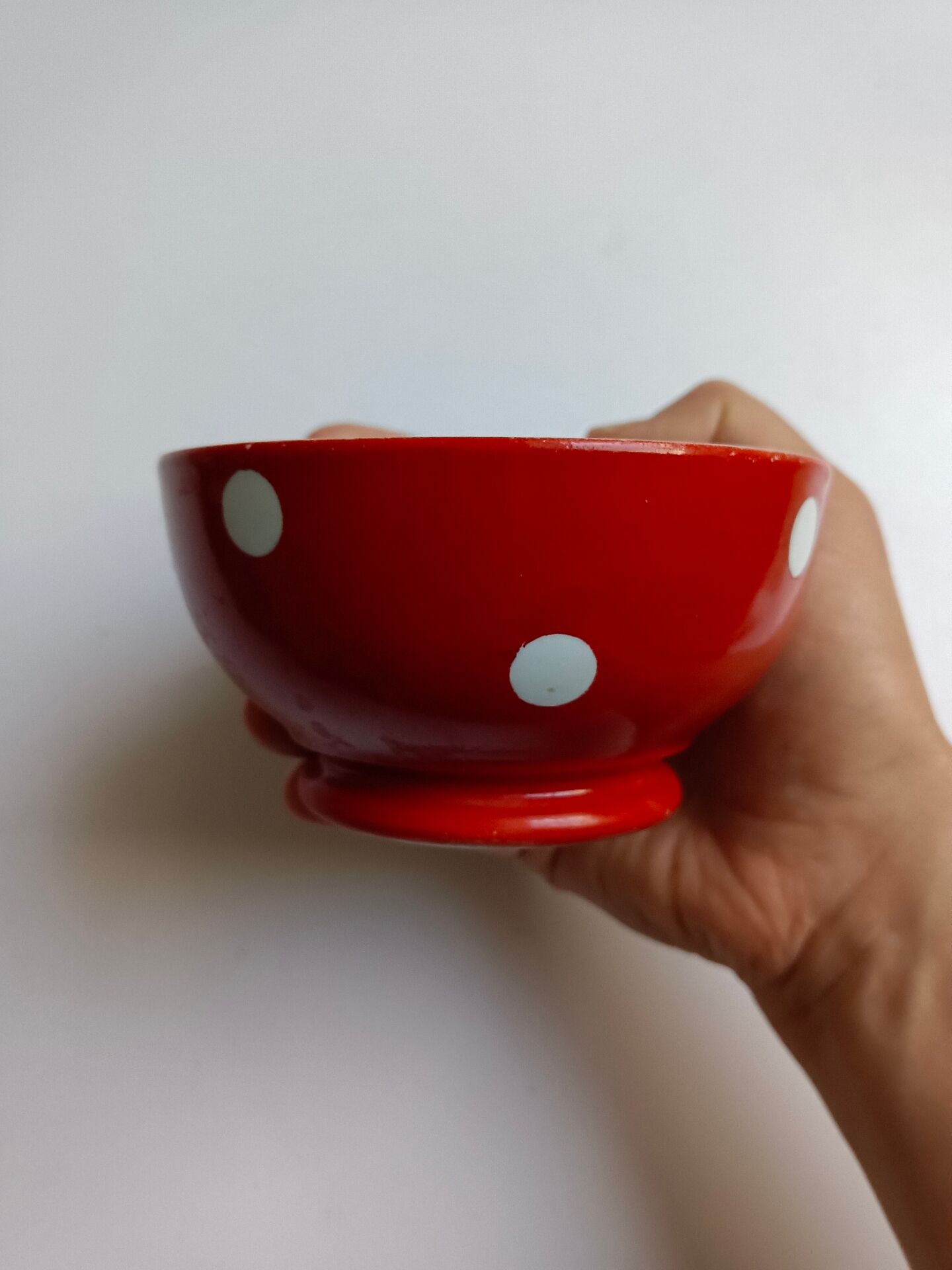 Red bowl with white polka dots in Longchamp ceramic
