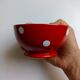 Red bowl with white polka dots in Longchamp ceramic