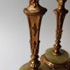 Pair of neoclassical candle holders in gilded bronze and green onyx, bust of