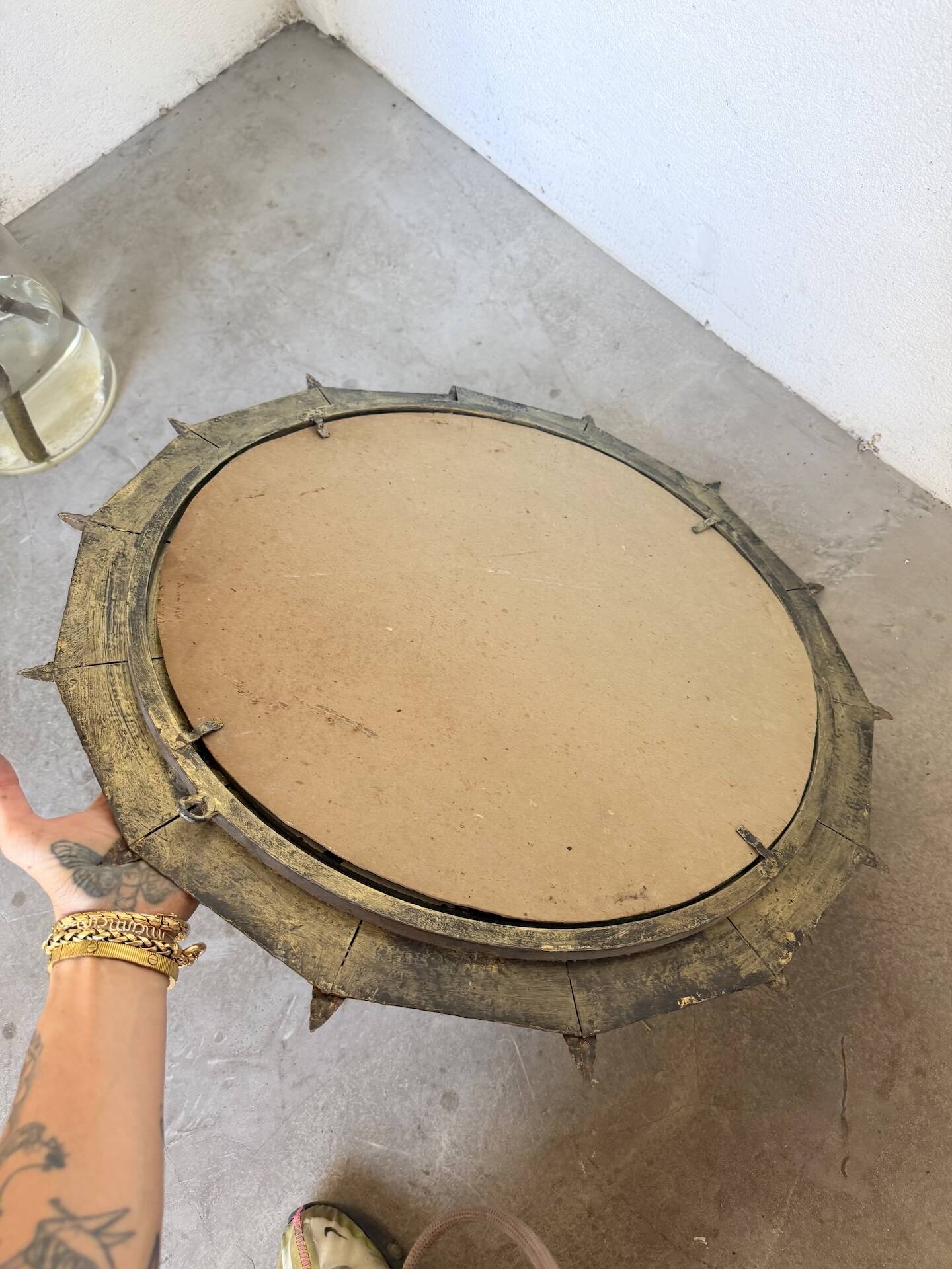Brutalist round hammered gold metal mirror
