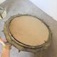 Brutalist round hammered gold metal mirror