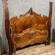 Center bed Louis XV rocaille of curved shape in walnut