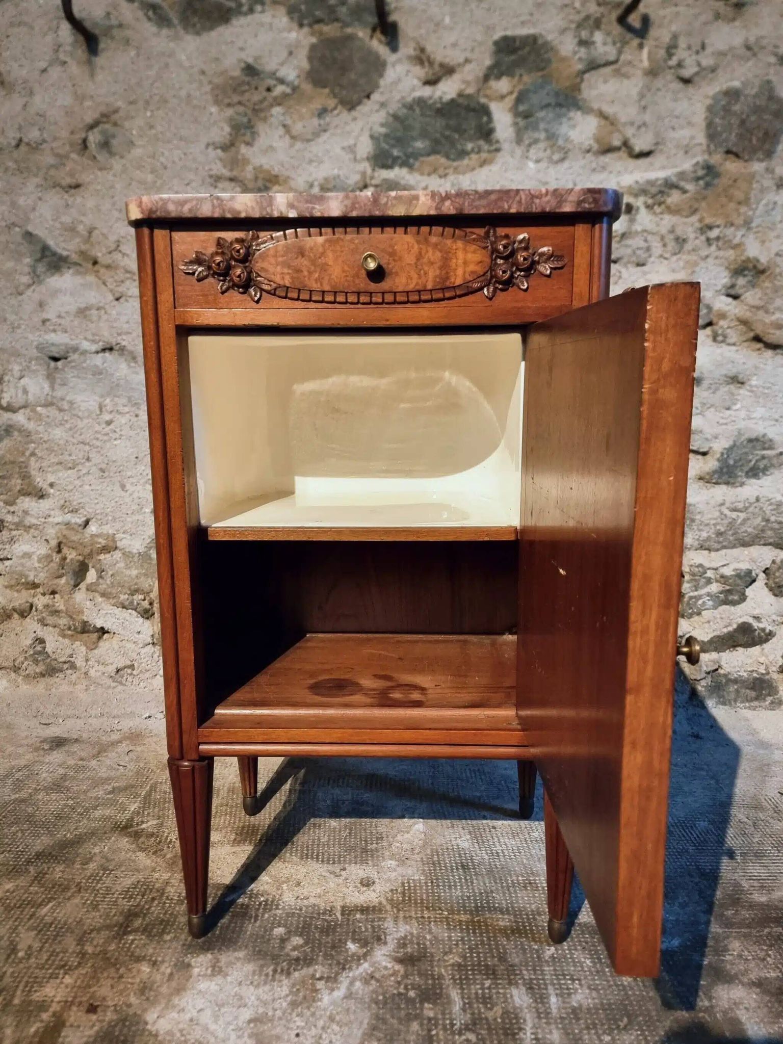 French antique bedside table in walnut with a marble top and porcelain interior, early 20th century.