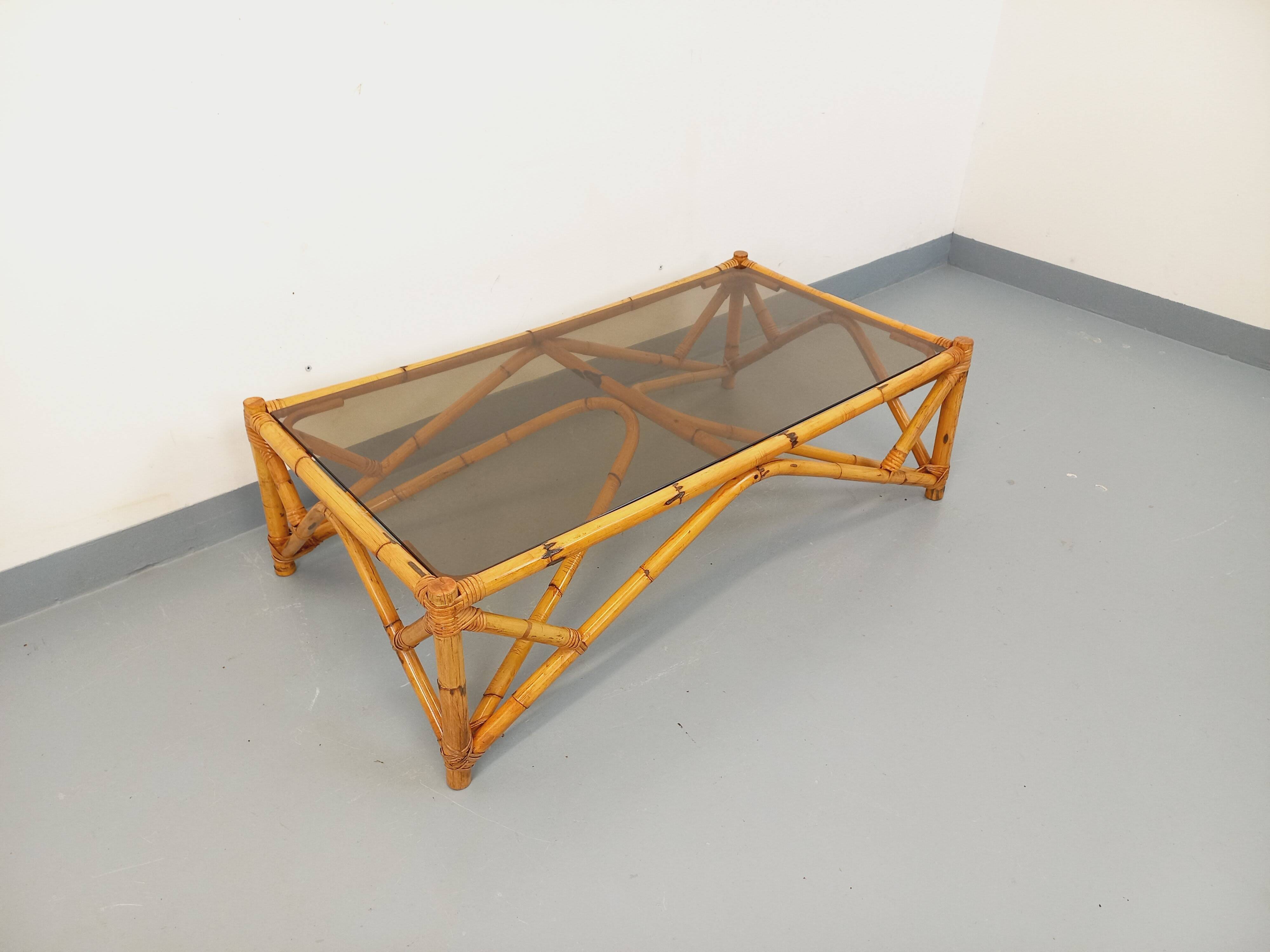 Vintage rectangular coffee table in rattan and smoked glass from the 1970s.