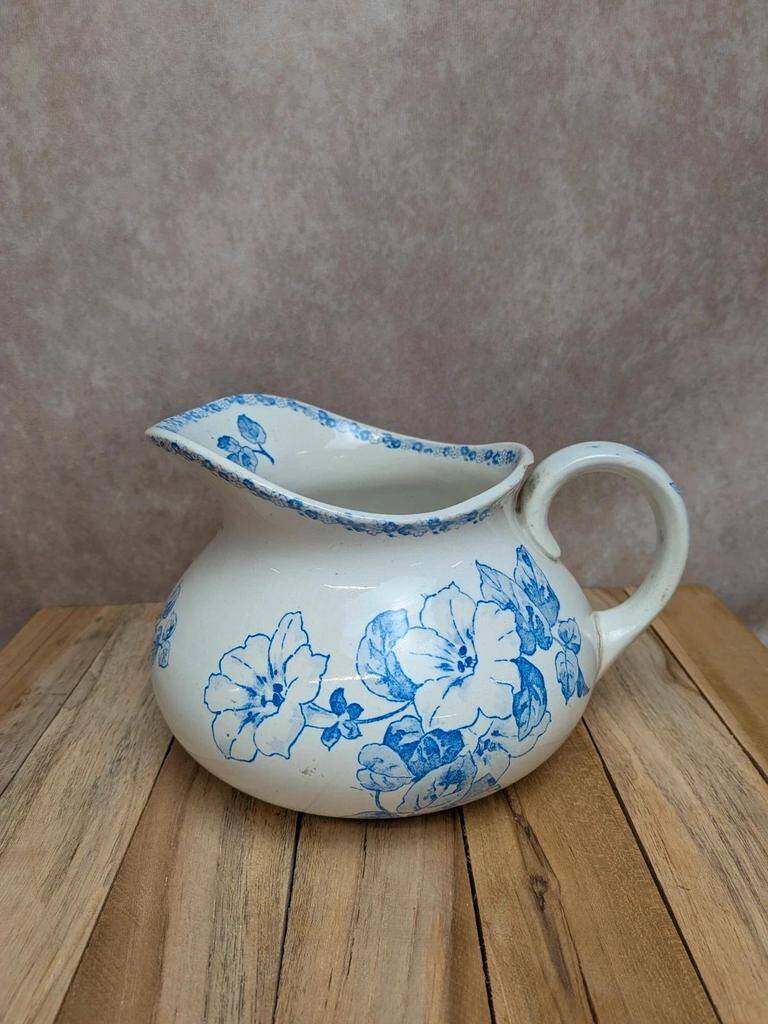 Small antique ironstone jug L.m Creil and Montereau with blue floral decoration.