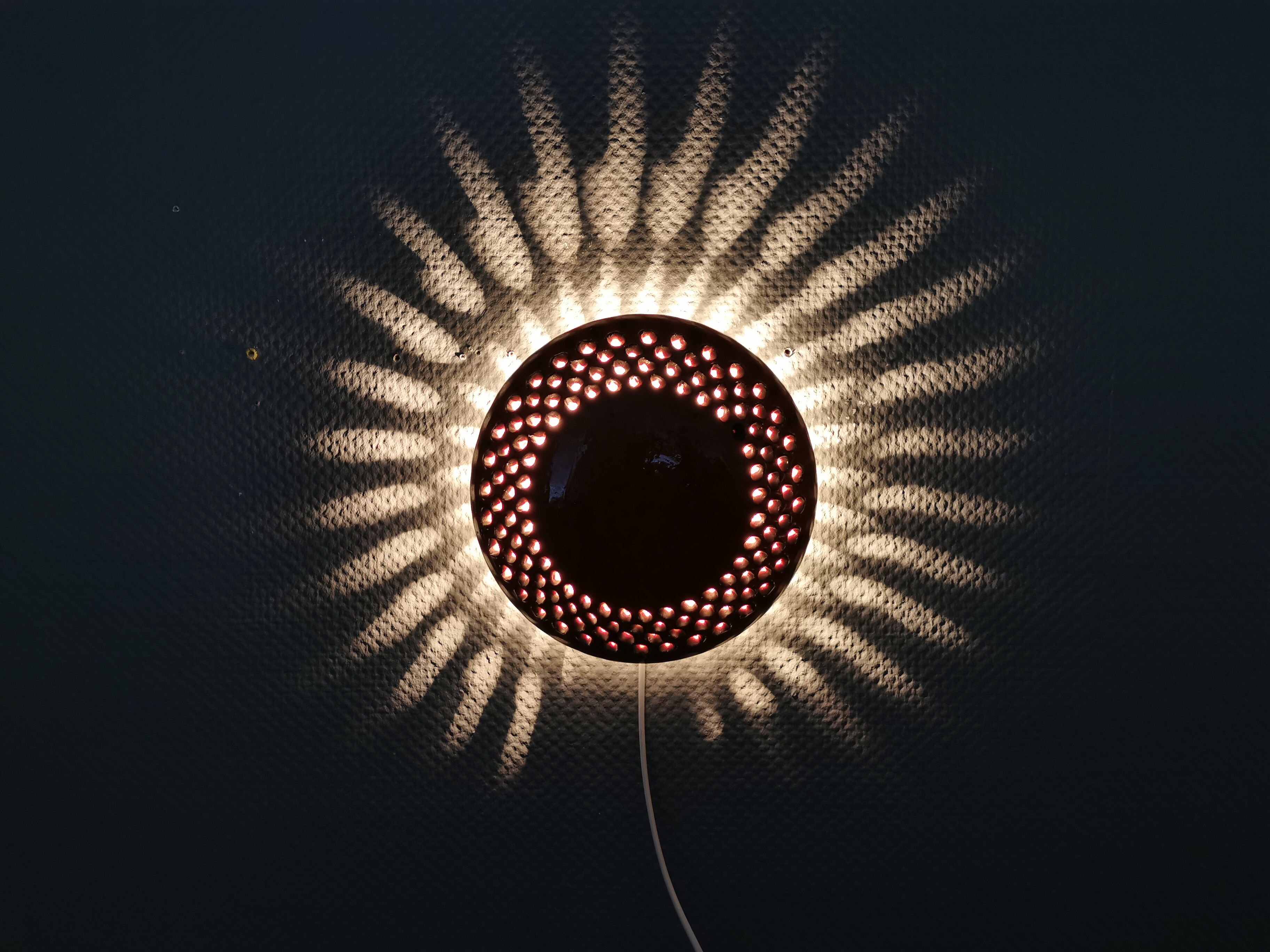 Danish ceramic wall lamp, in nice red glaze. From the 1960s