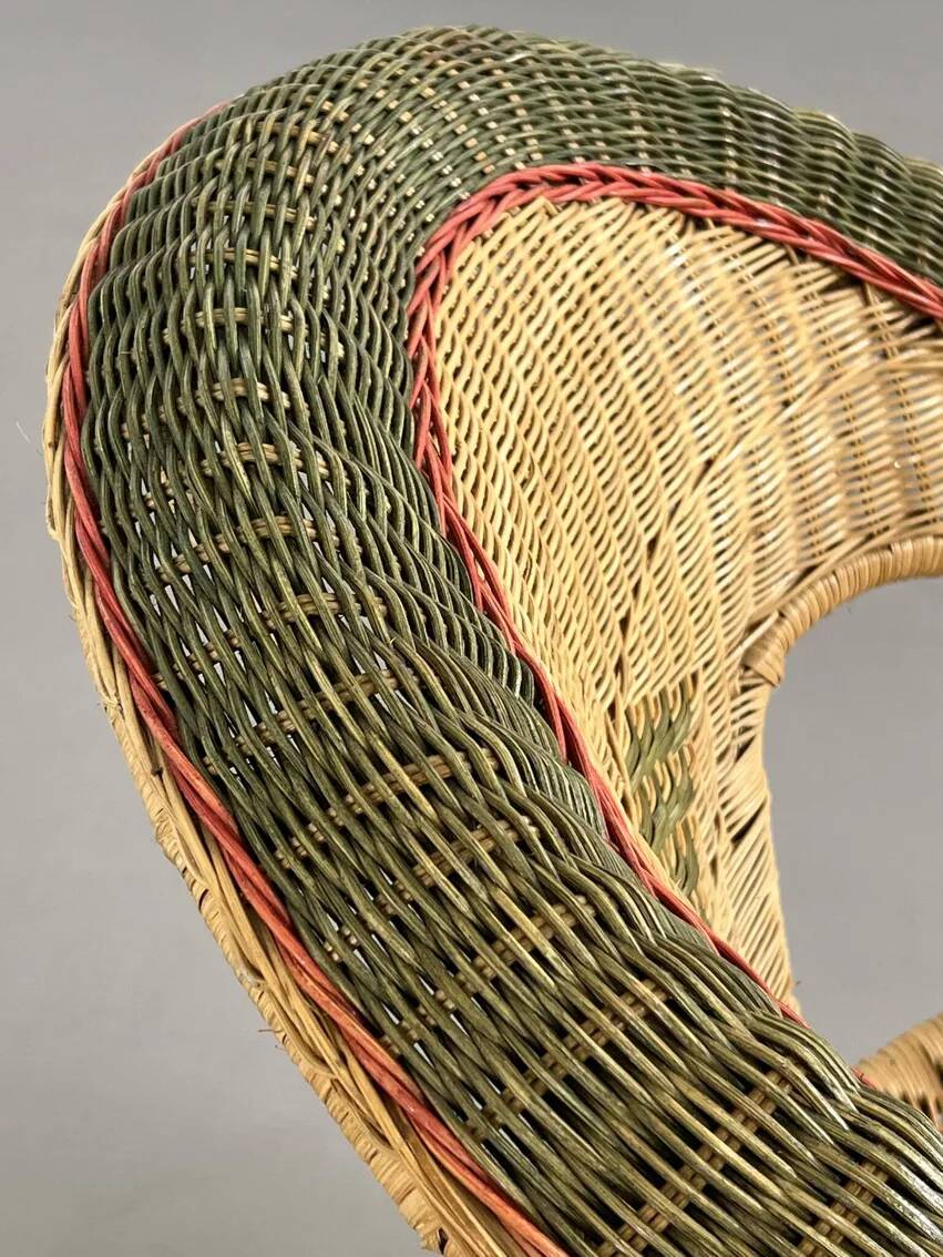 Rattan, wicker and green and red edging cabriolet style armchair