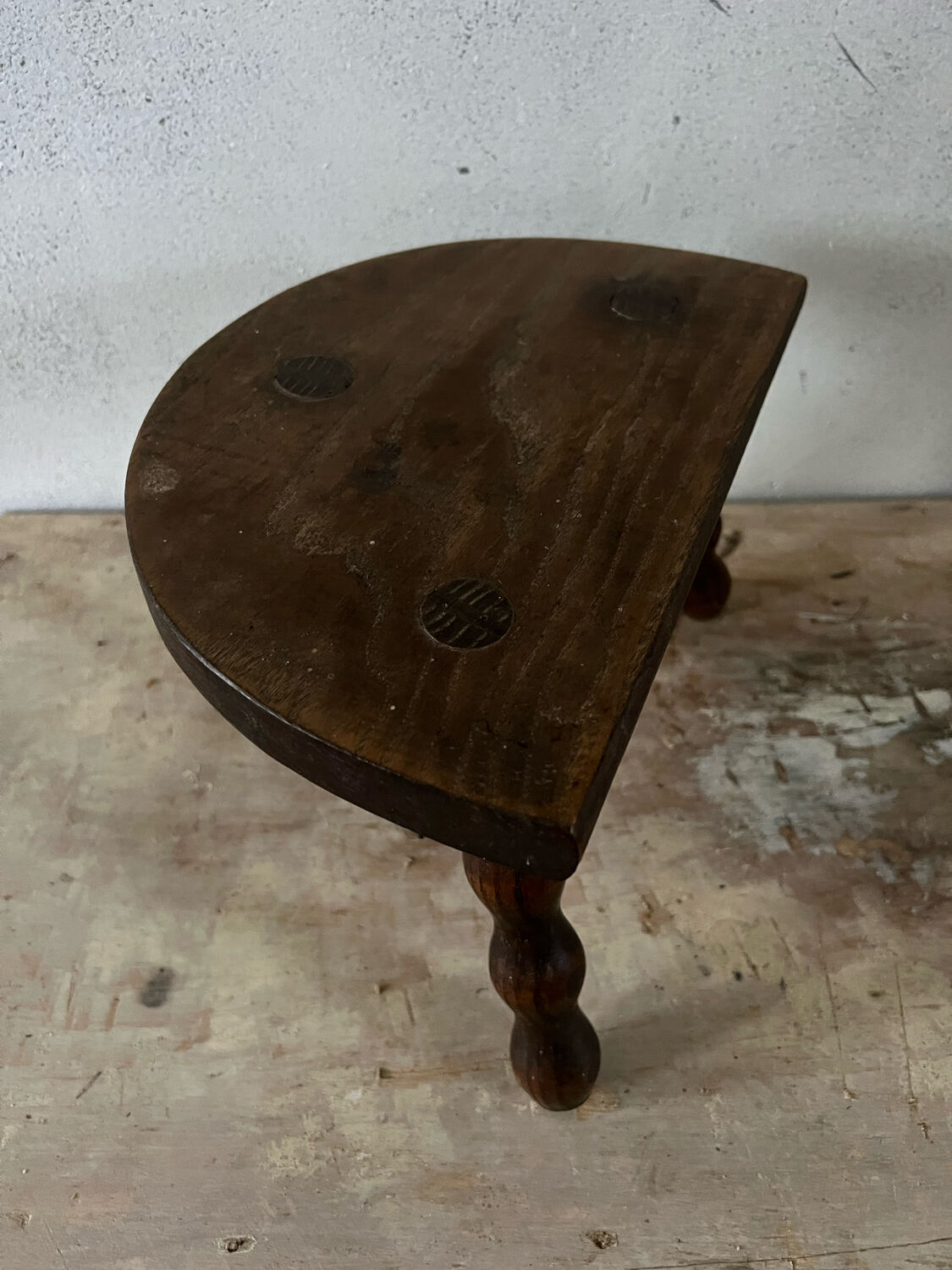 Wooden tripod farm stool